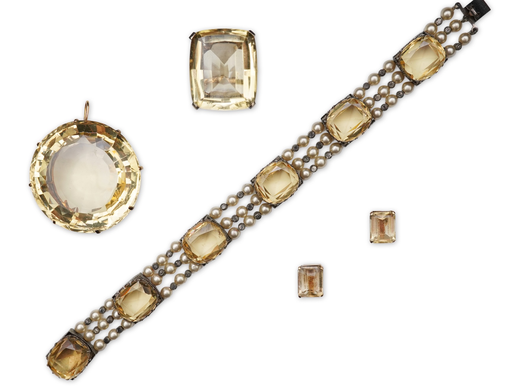 A collection of citrine jewels and a paste bracelet